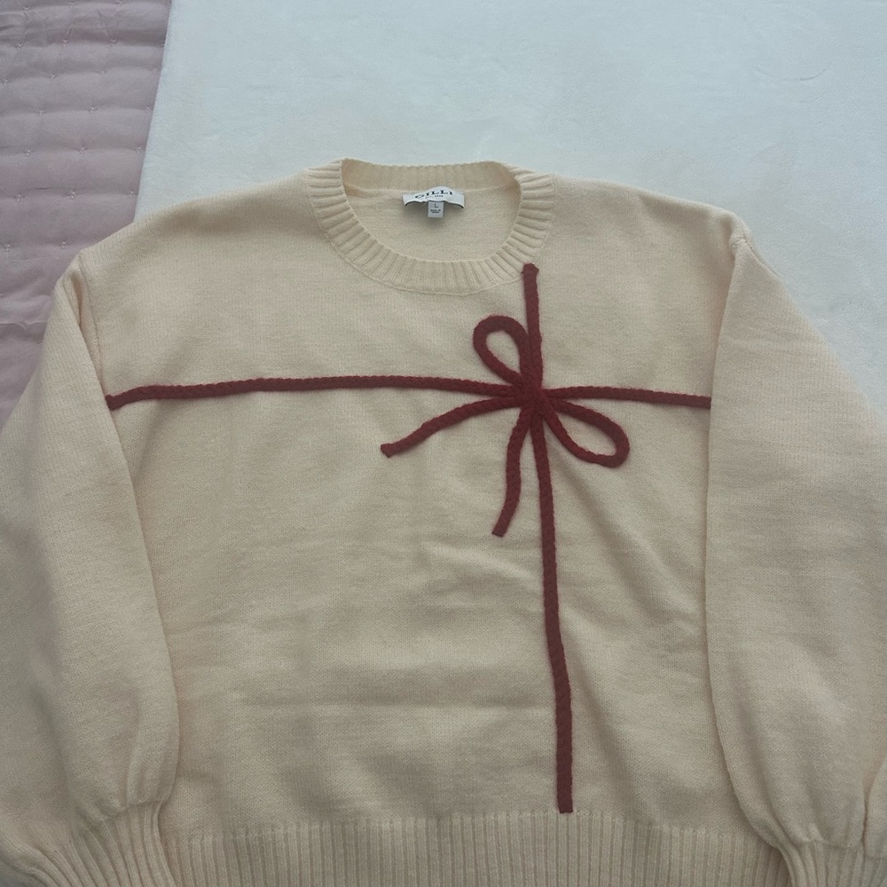 Holiday Cream Sweater with Red Bow Design